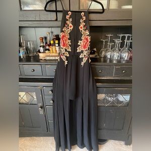 Windsor dress, size M. Long in back, short in front. Black with red flowers.